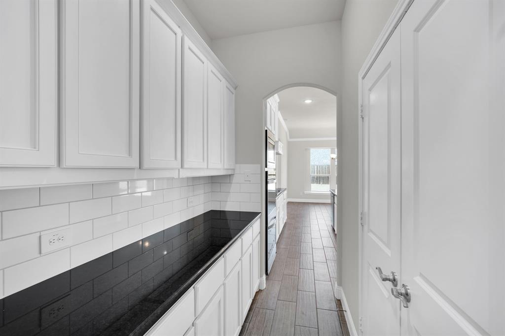 395 Haven Road Waxahachie, TX 75165 - Photo 14 of 40 a kitchen with a sink and cabinets