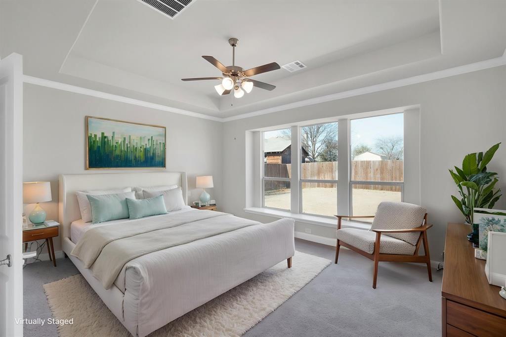 395 Haven Road Waxahachie, TX 75165 - Photo 16 of 40 a bedroom with a large bed and a couch