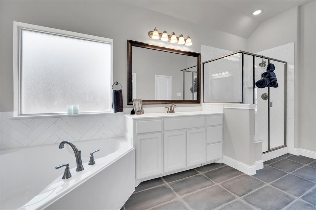 395 Haven Road Waxahachie, TX 75165 - Photo 18 of 40 a bathroom with a double vanity sink mirror and bathtub
