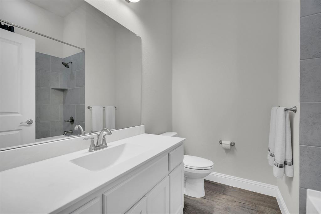 395 Haven Road Waxahachie, TX 75165 - Photo 26 of 40 a bathroom with a sink toilet and shower