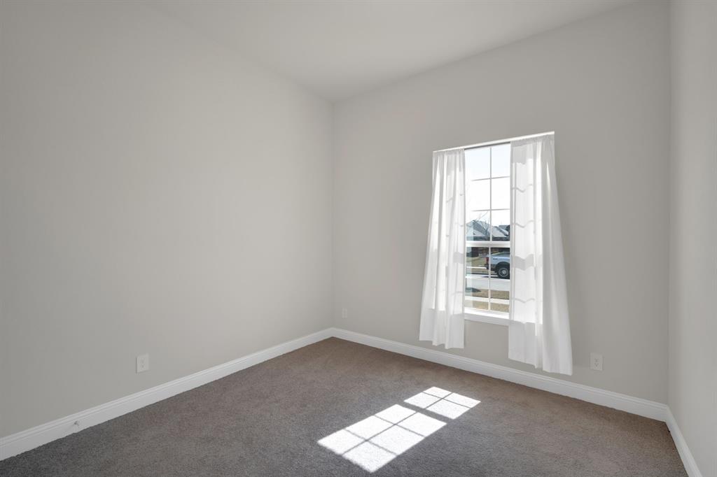 395 Haven Road Waxahachie, TX 75165 - Photo 28 of 40 an empty room with windows