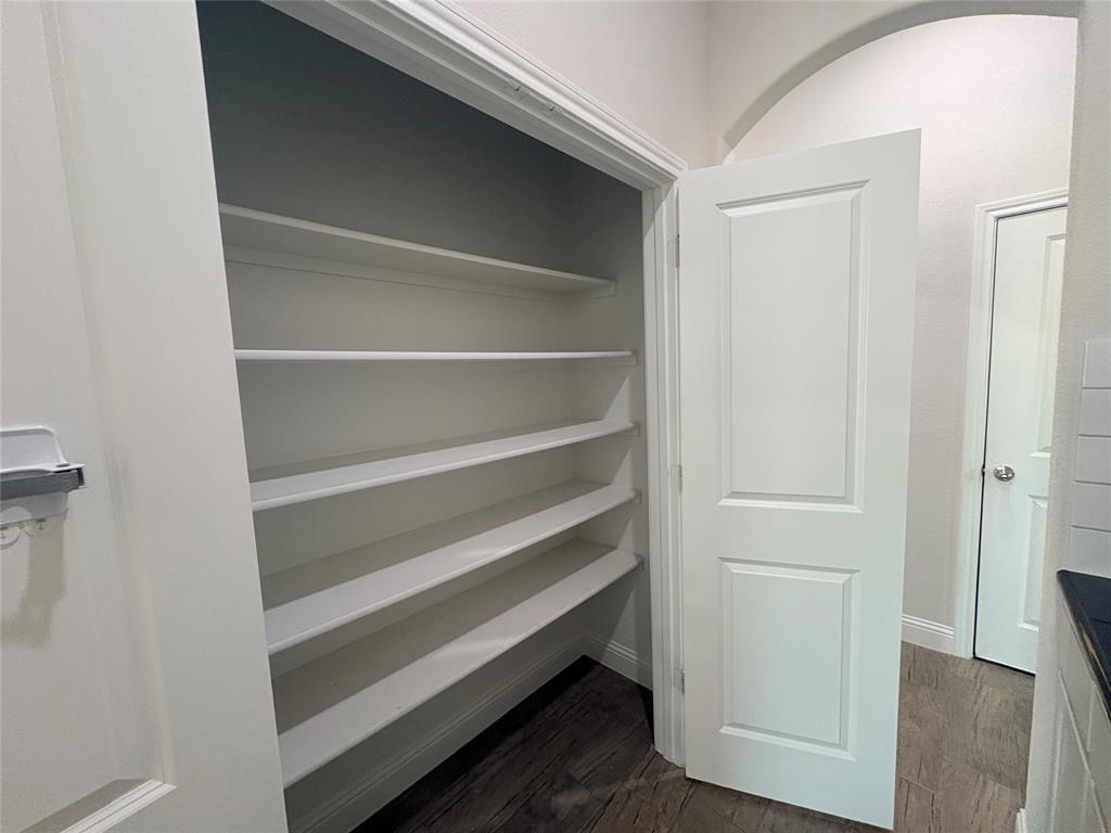 395 Haven Road Waxahachie, TX 75165 - Photo 35 of 40 a view of walk in closet with empty racks