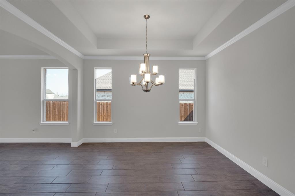 395 Haven Road Waxahachie, TX 75165 - Photo 8 of 40 a view of a room with wooden floor and chandelier