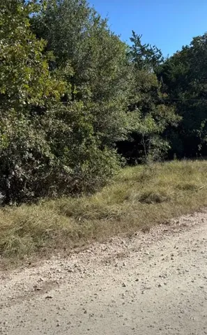 a view of a lake with houses in the back