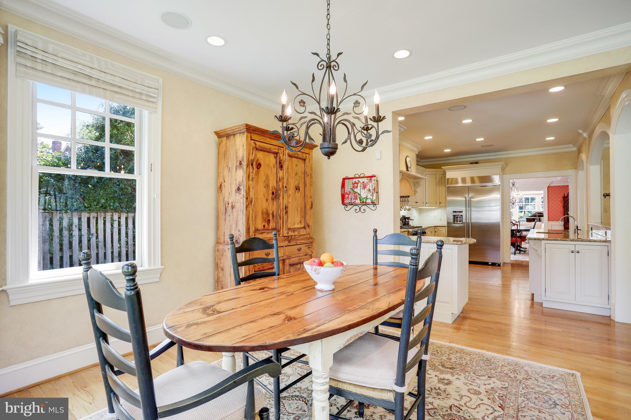 5629 Newington Road Bethesda, MD 20816 - Photo 15 of 65 a view of a dining room with furniture and wooden floor