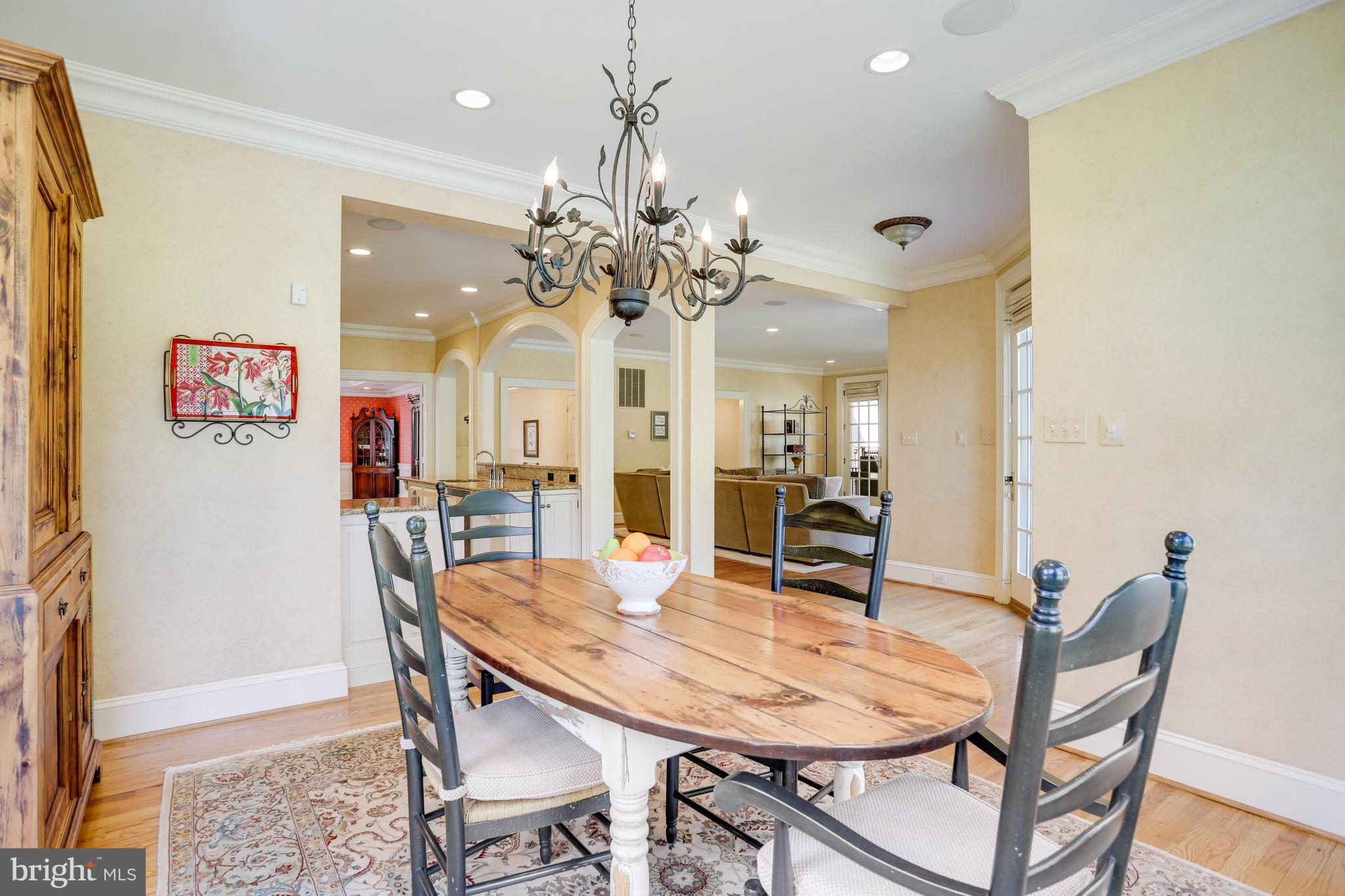 5629 Newington Road Bethesda, MD 20816 - Photo 16 of 65 a view of a dining room with furniture and wooden floor