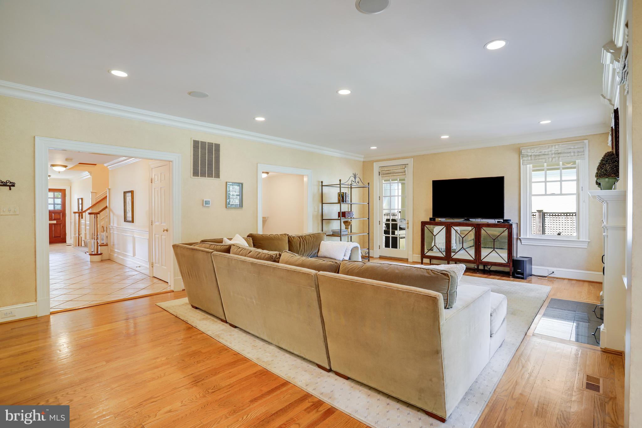 5629 Newington Road Bethesda, MD 20816 - Photo 18 of 65 a living room with furniture and a flat screen tv