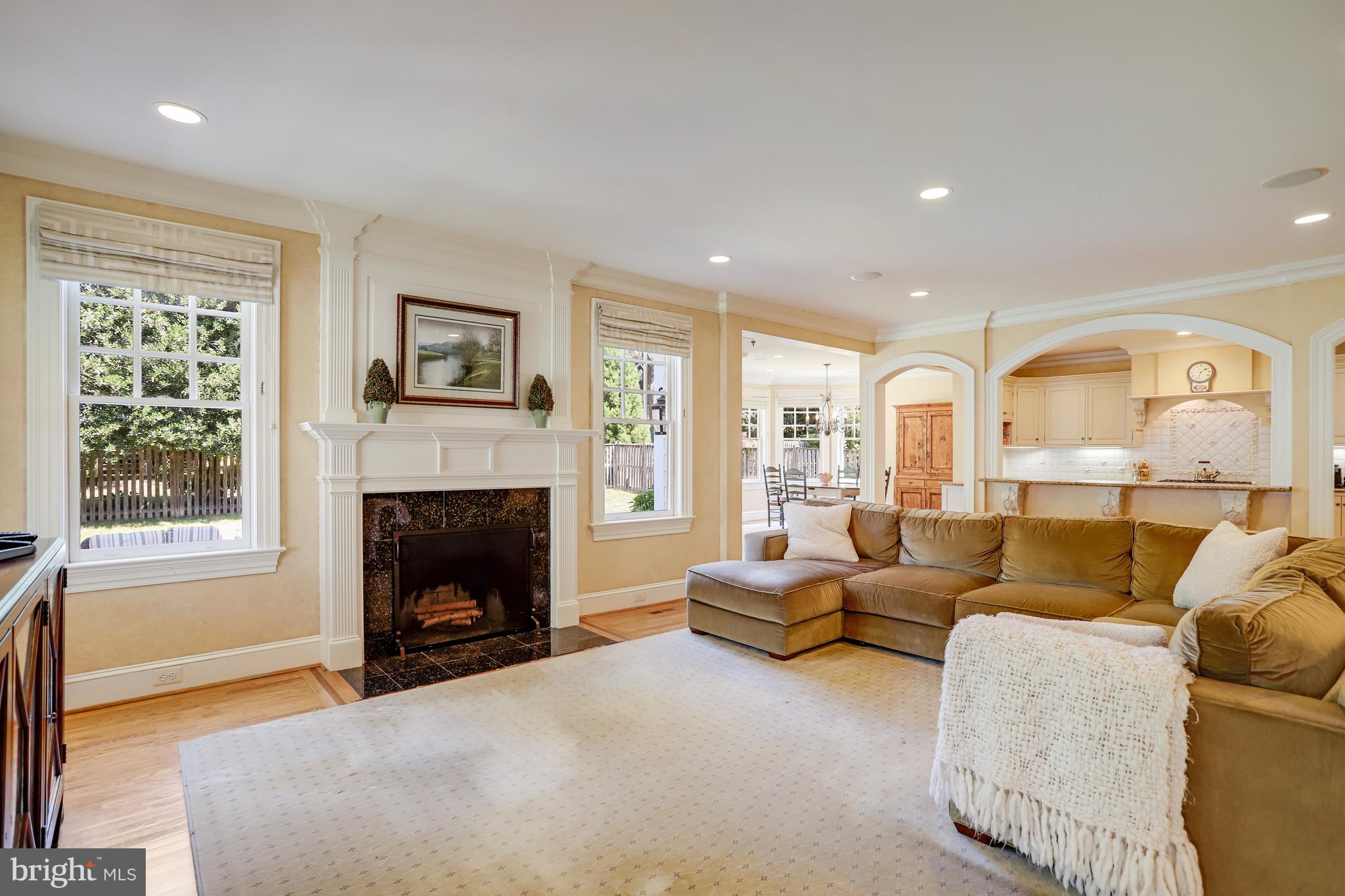 5629 Newington Road Bethesda, MD 20816 - Photo 21 of 65 a living room with furniture and a fireplace