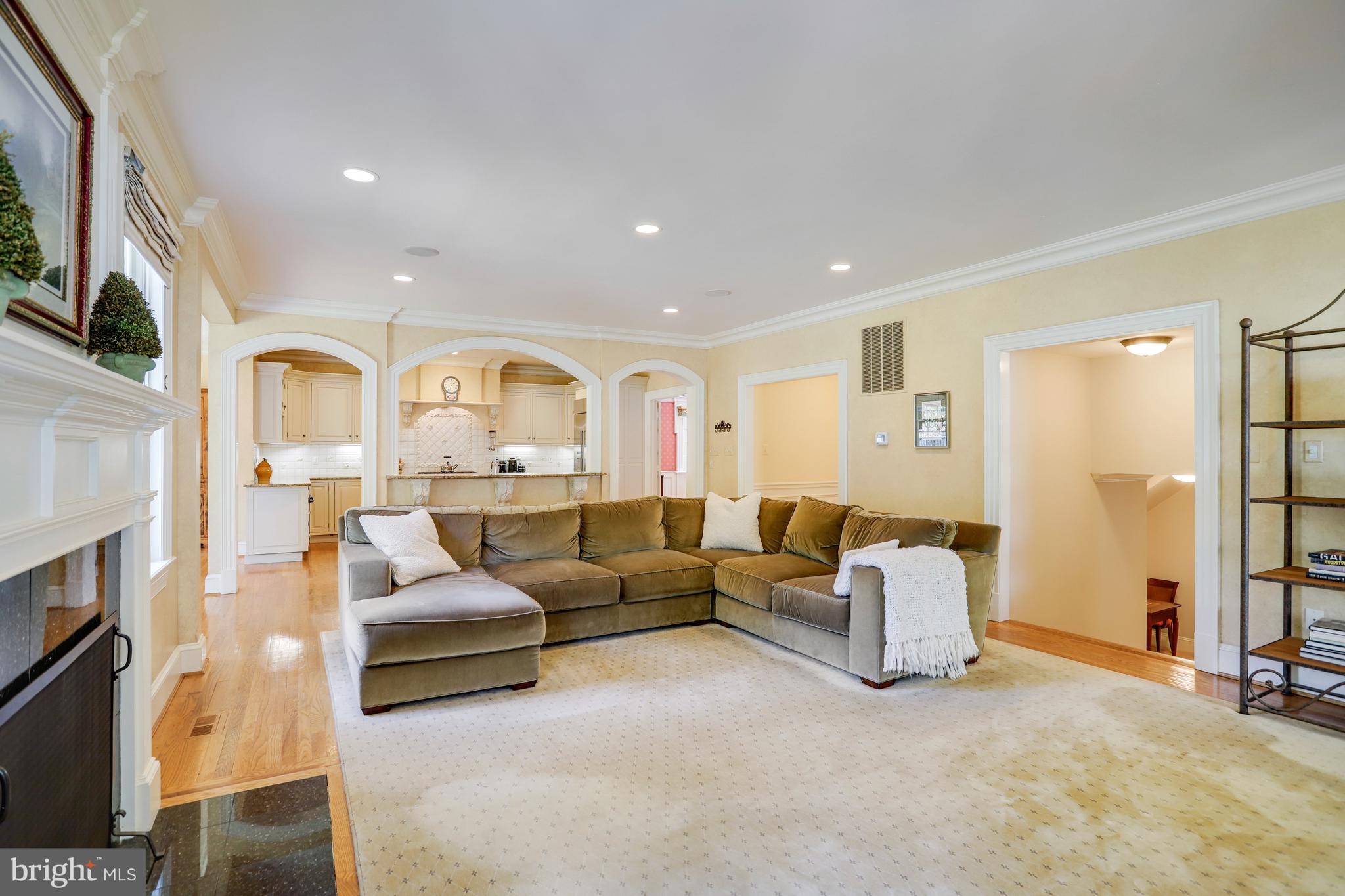 5629 Newington Road Bethesda, MD 20816 - Photo 22 of 65 a living room with fireplace furniture and a flat screen tv