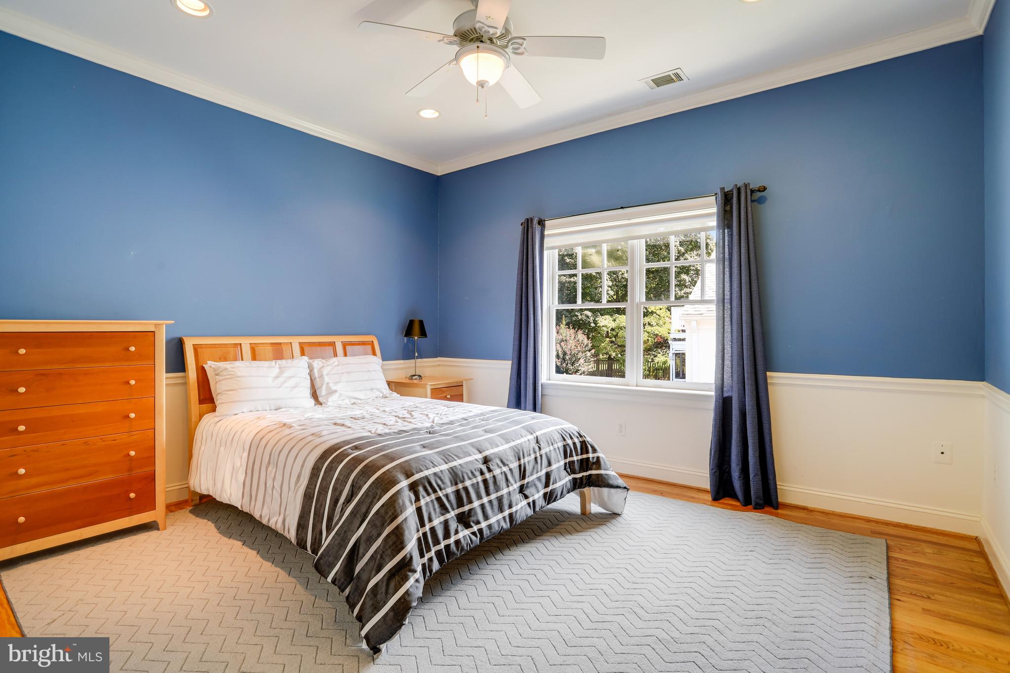 5629 Newington Road Bethesda, MD 20816 - Photo 34 of 65 a bedroom with a large bed and a window