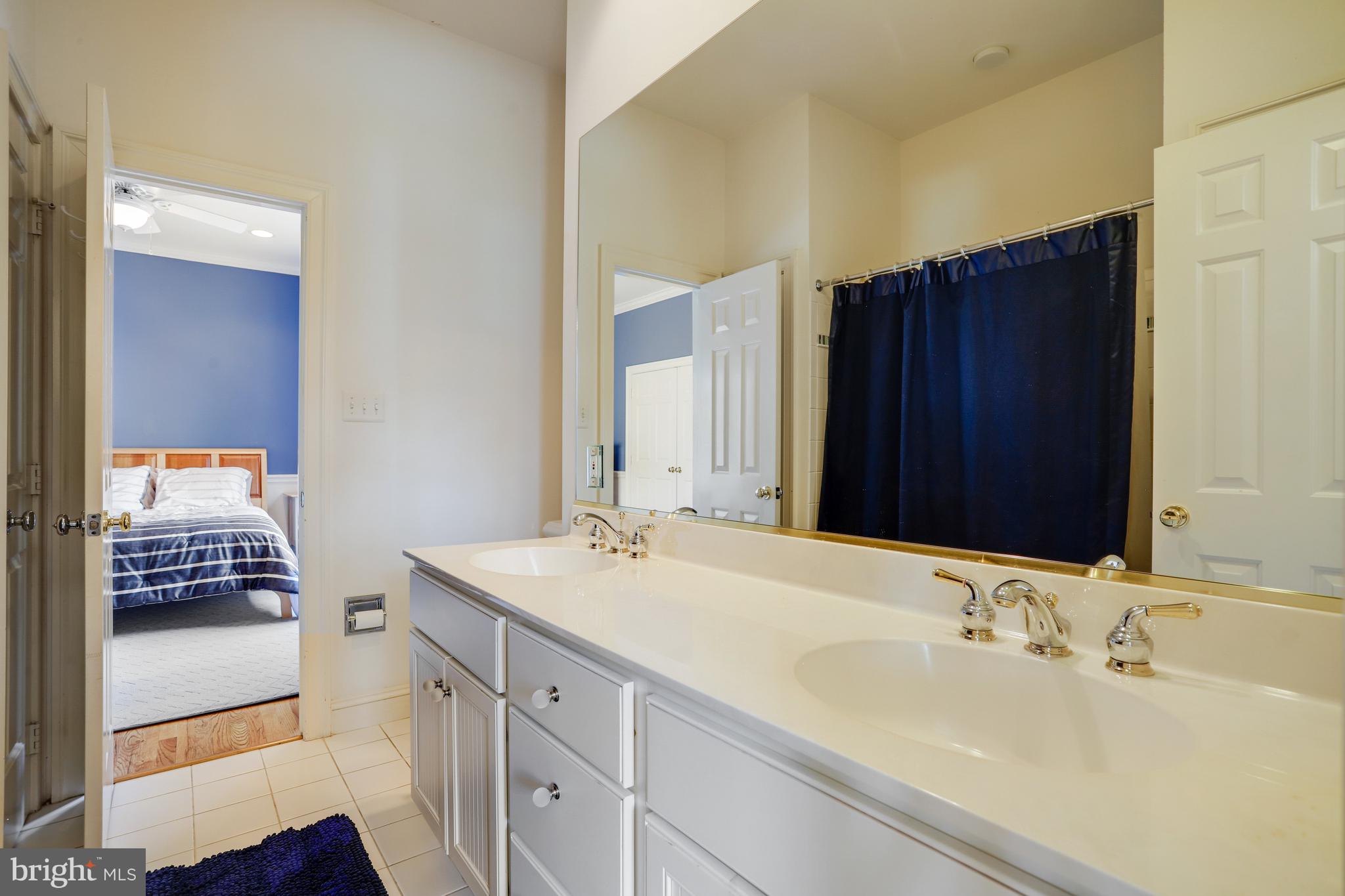 5629 Newington Road Bethesda, MD 20816 - Photo 35 of 65 a bathroom with a sink and a mirror