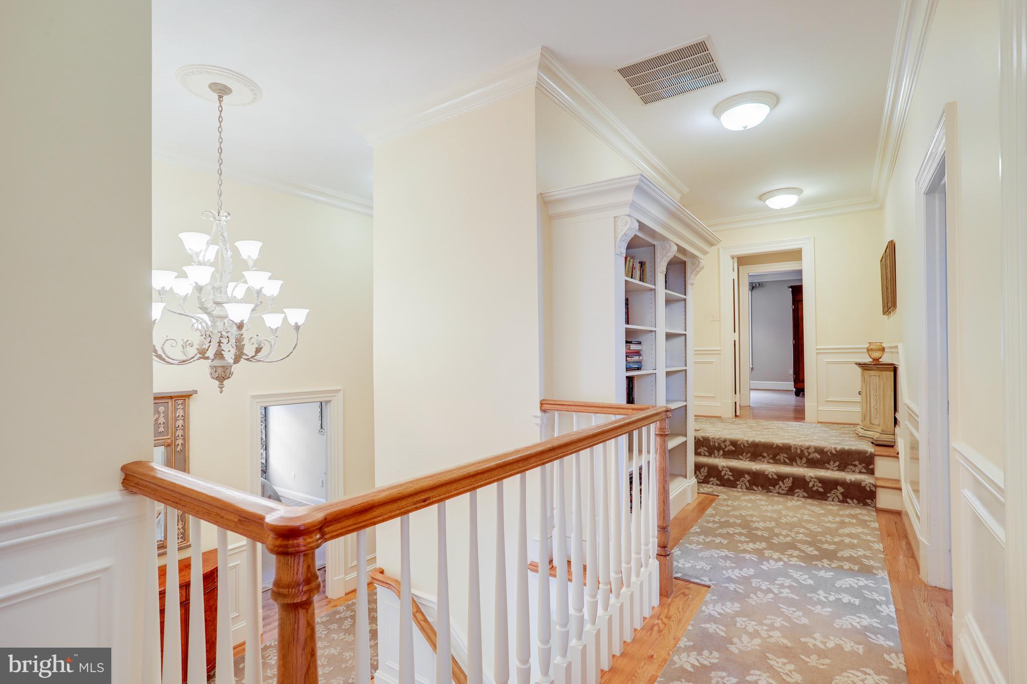 5629 Newington Road Bethesda, MD 20816 - Photo 37 of 65 a view of a hallway to a livingroom with furniture