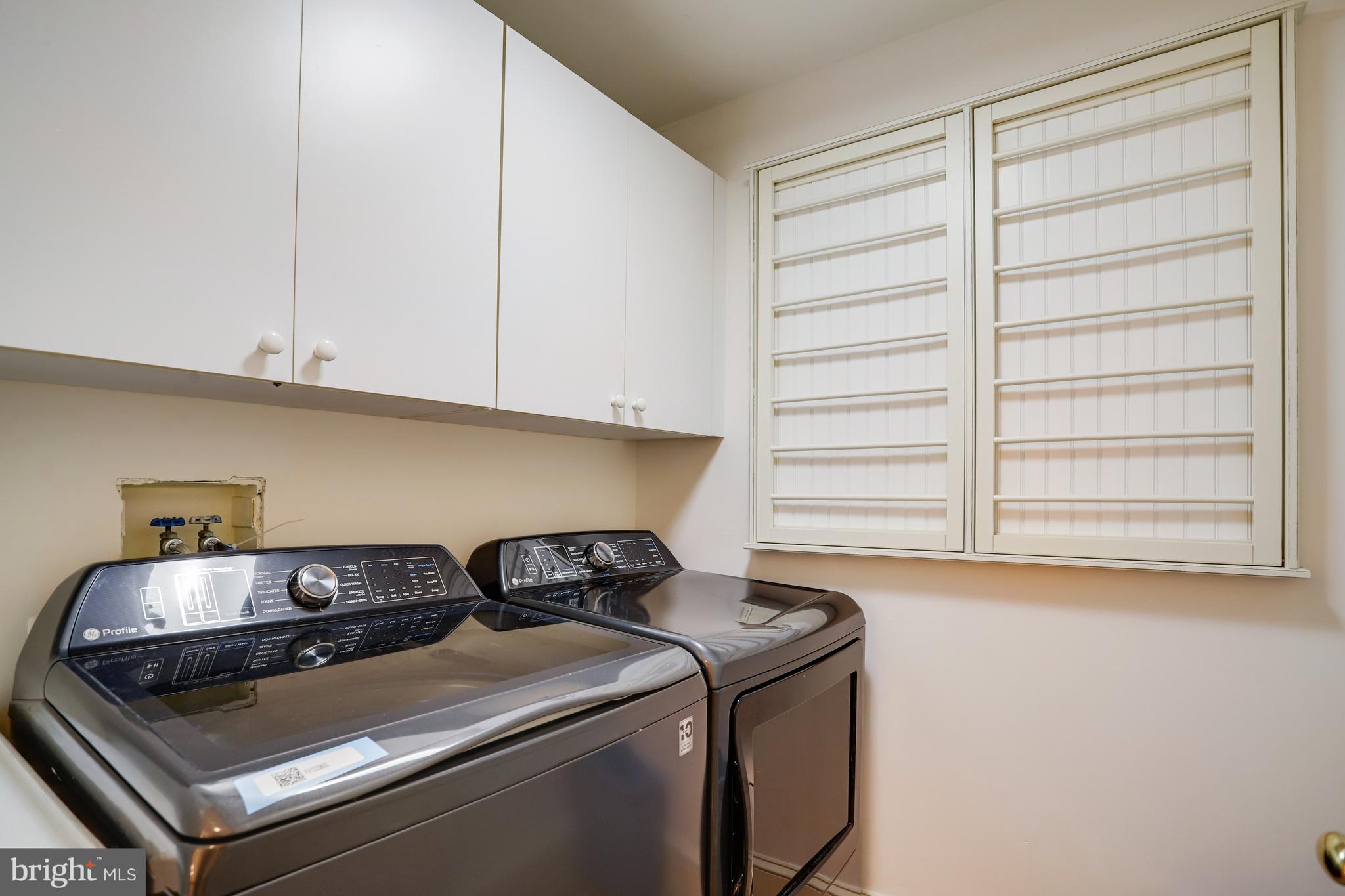 5629 Newington Road Bethesda, MD 20816 - Photo 42 of 65 a utility room with dryer and washer