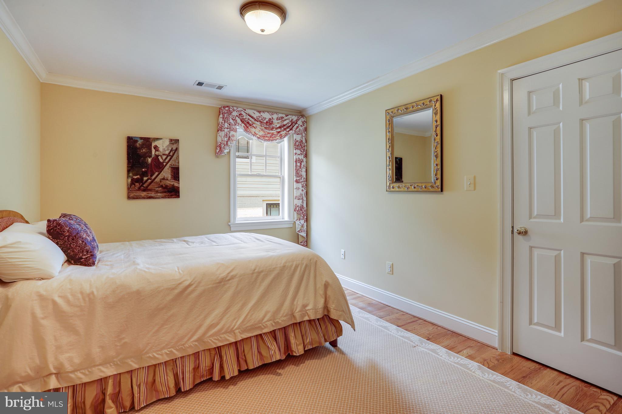 5629 Newington Road Bethesda, MD 20816 - Photo 45 of 65 a bedroom with a bed and a window