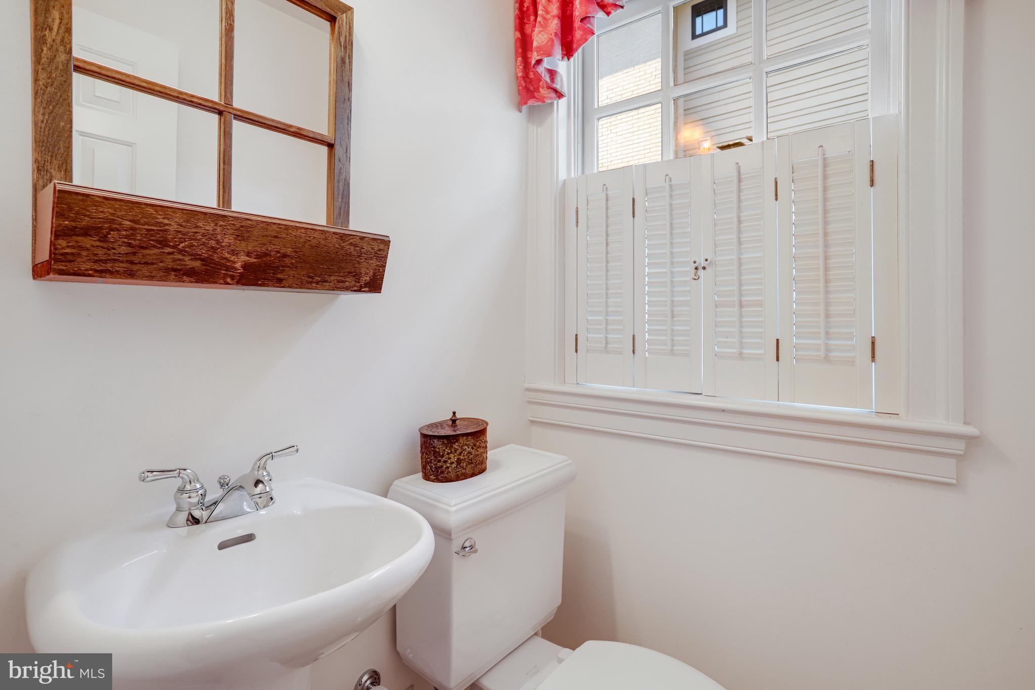 5629 Newington Road Bethesda, MD 20816 - Photo 50 of 65 a bathroom with a sink and a mirror