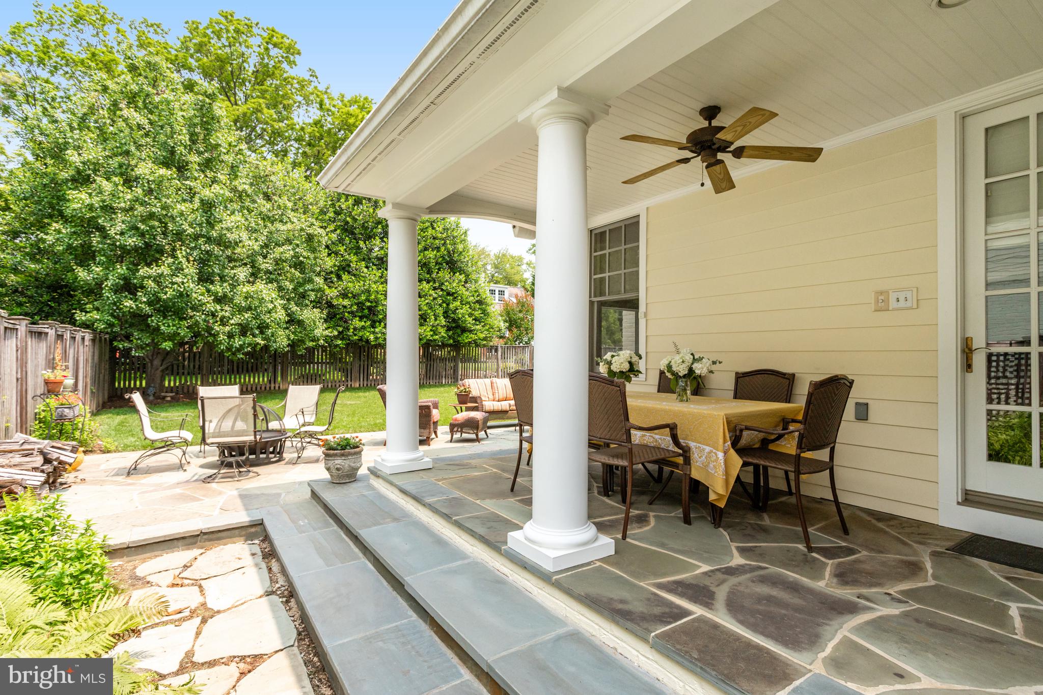 5629 Newington Road Bethesda, MD 20816 - Photo 57 of 65 a view of a patio with a dining table and chairs