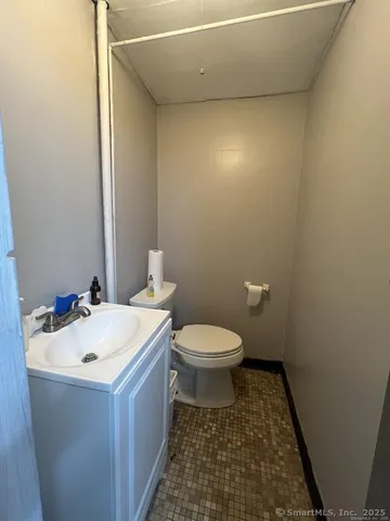 a bathroom with a sink and a toilet