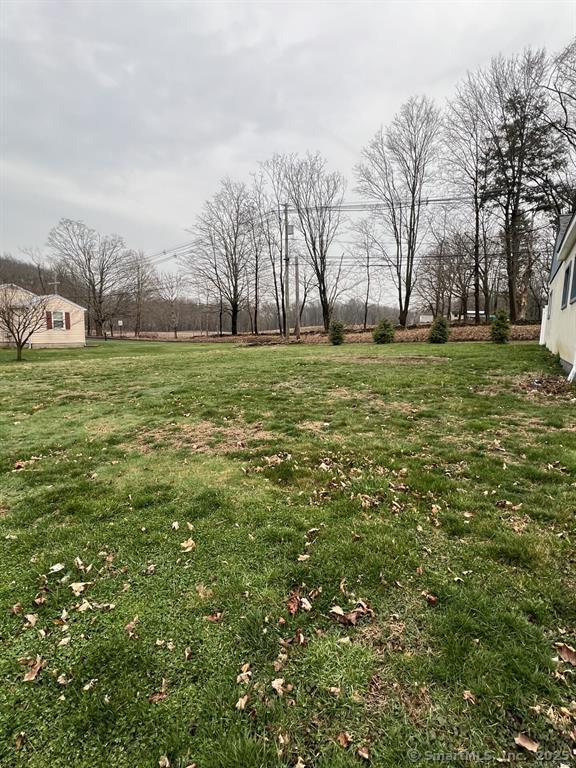 361 Pomeroy Avenue Meriden, CT 06450 - Photo 20 of 25 a view of a field with large trees