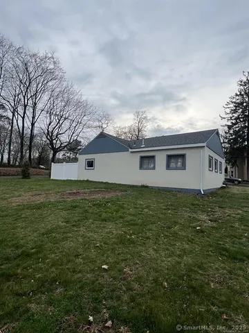 a aerial view of a house with a yard