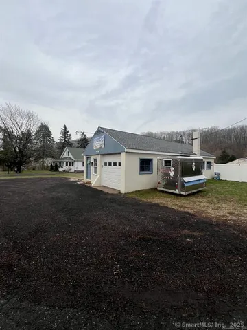 a aerial view of a house with a yard
