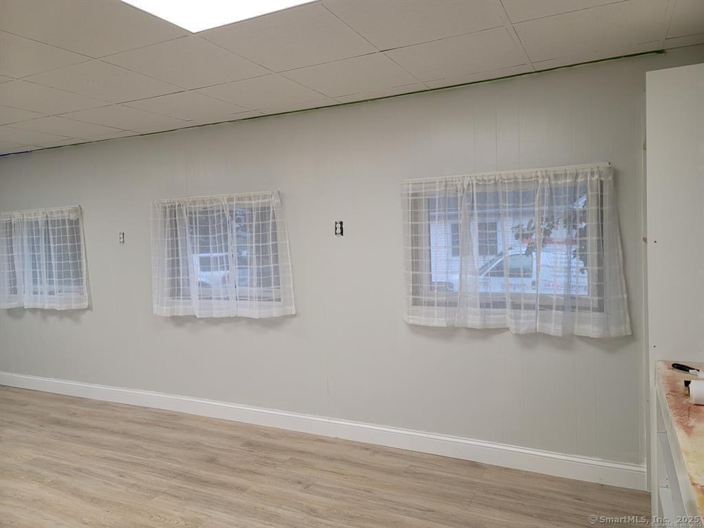 361 Pomeroy Avenue Meriden, CT 06450 - Photo 4 of 25 a view of a small space with wooden floor and windows
