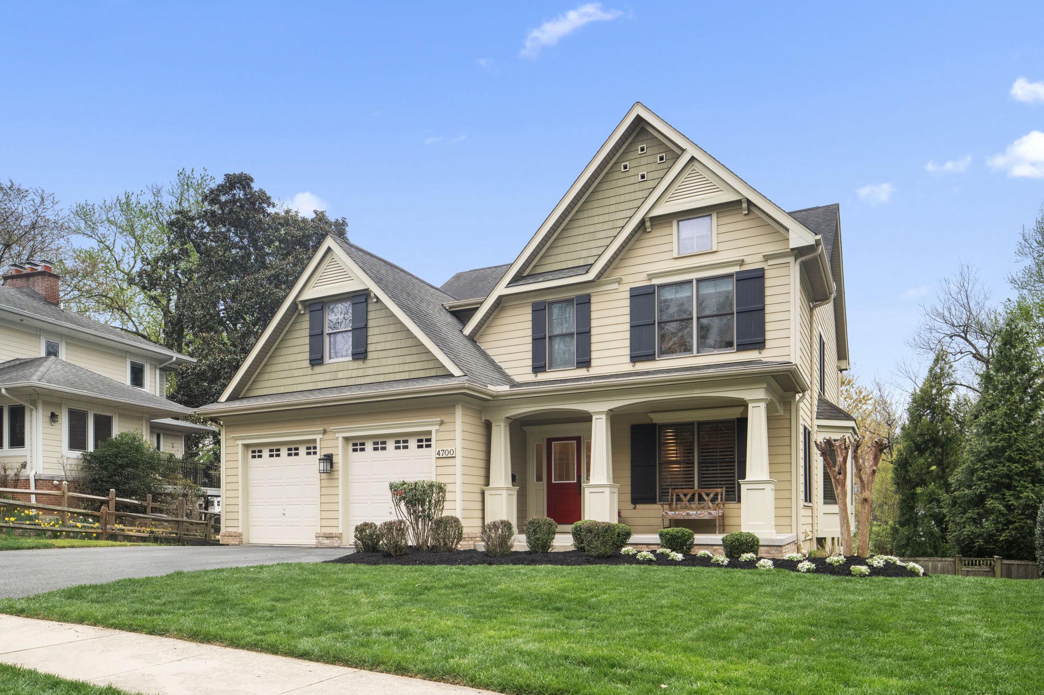 a front view of a house with a yard and porch