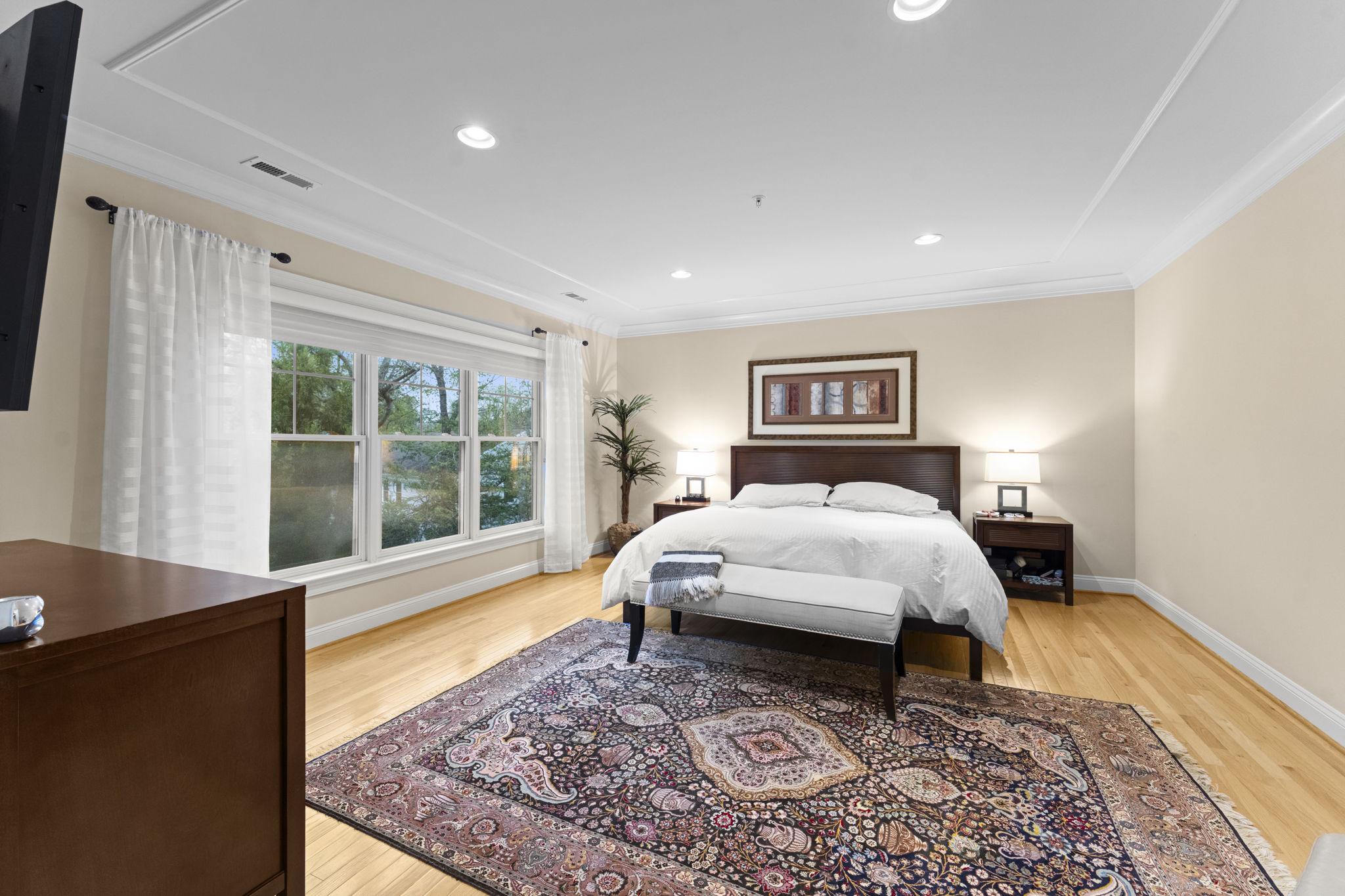 4700 Edgefield Road Bethesda, MD 20814 - Photo 13 of 29 a spacious bedroom with a large bed and a window