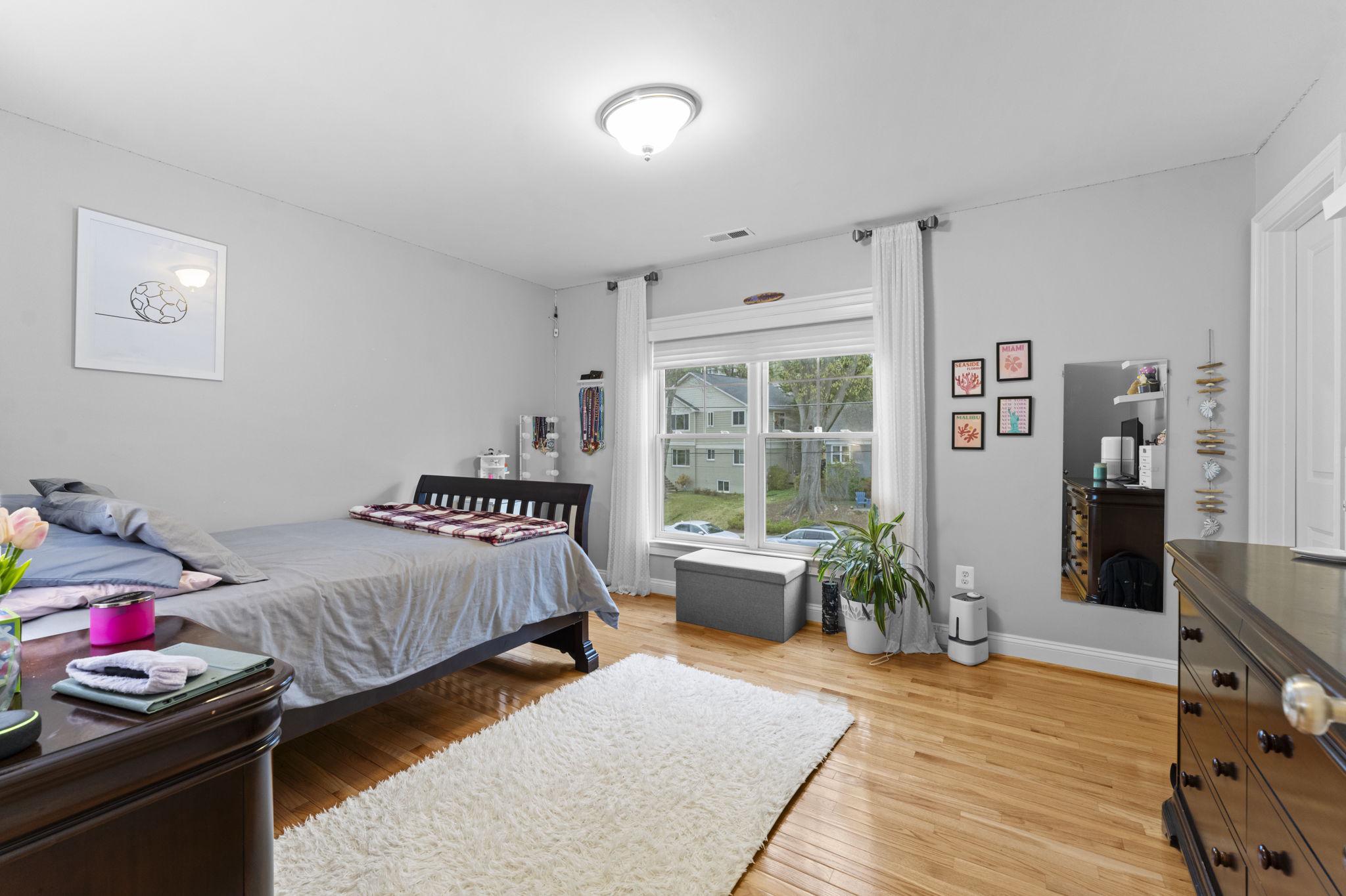 4700 Edgefield Road Bethesda, MD 20814 - Photo 19 of 29 a bedroom with furniture and a wooden floor