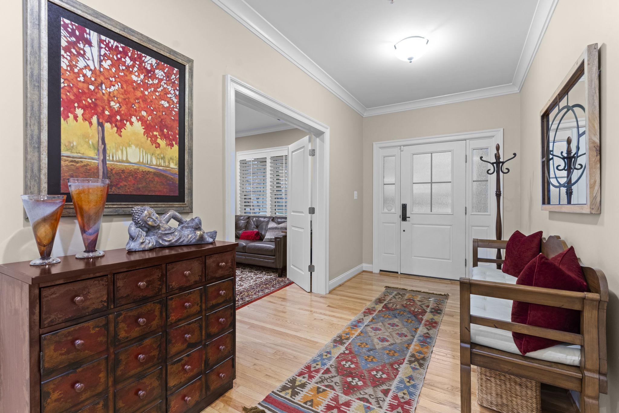 4700 Edgefield Road Bethesda, MD 20814 - Photo 2 of 29 a bedroom with a bed and a dresser in it