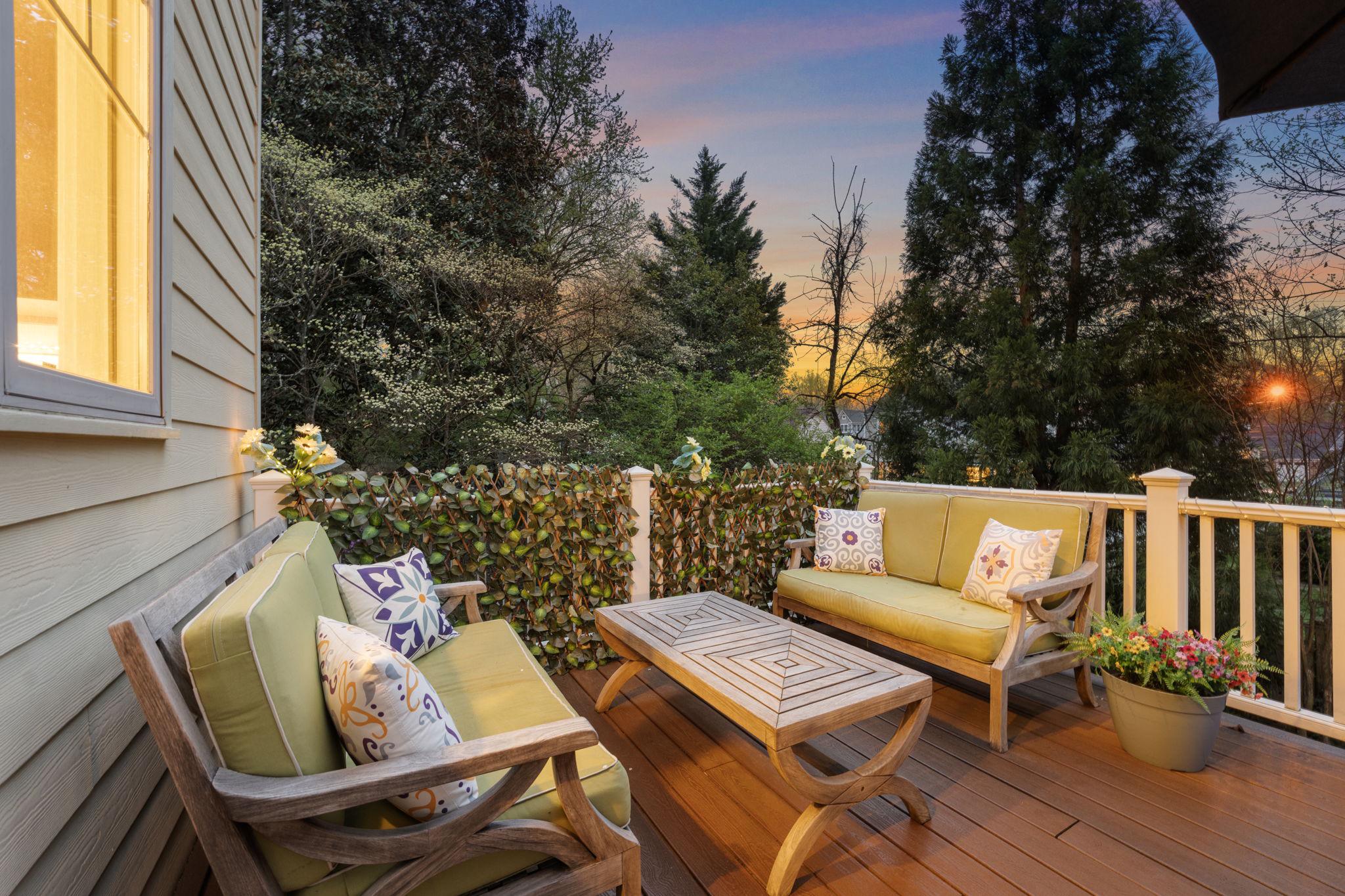 4700 Edgefield Road Bethesda, MD 20814 - Photo 26 of 29 a balcony with wooden floor and outdoor seating