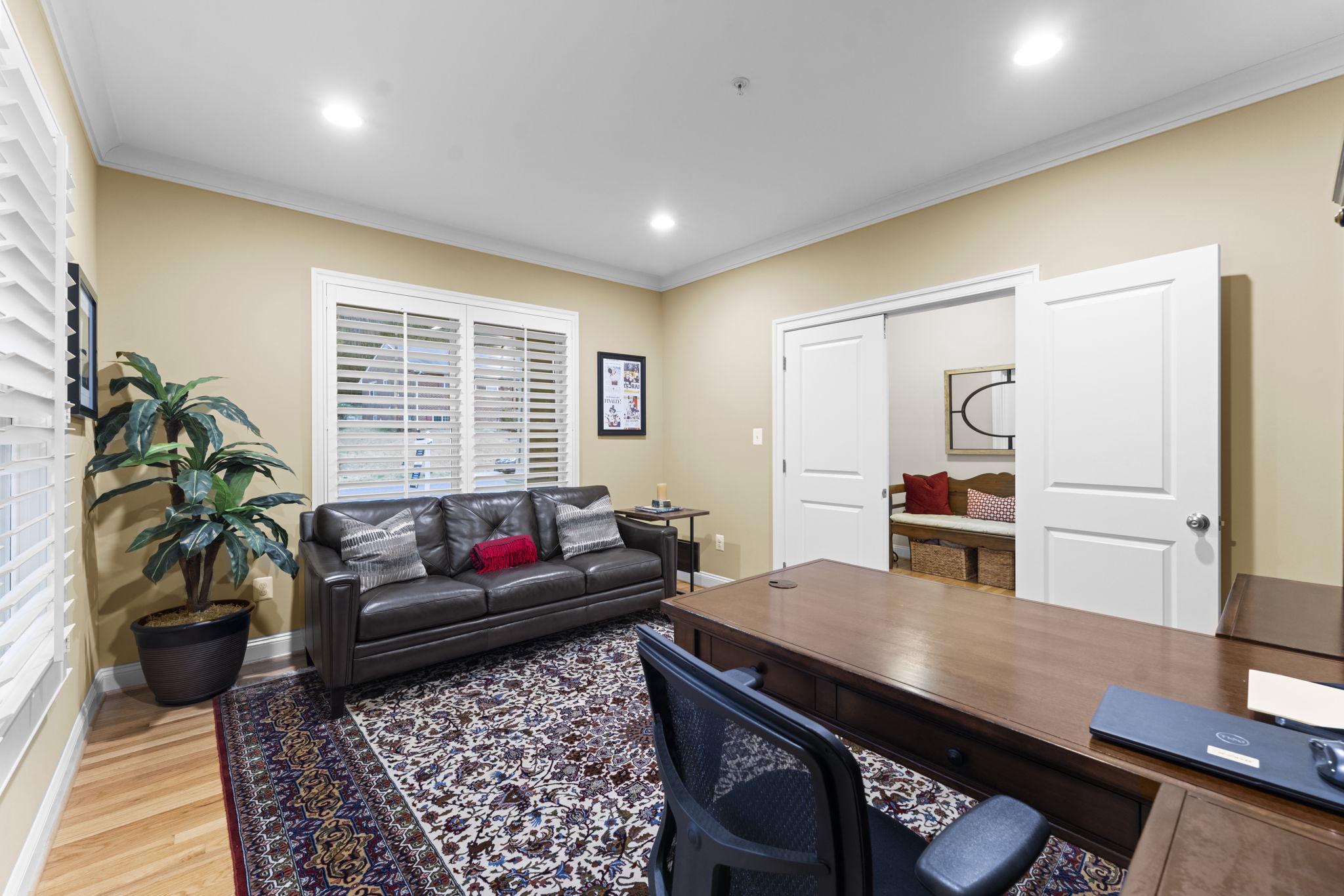 4700 Edgefield Road Bethesda, MD 20814 - Photo 4 of 29 a living room with furniture and a potted plant
