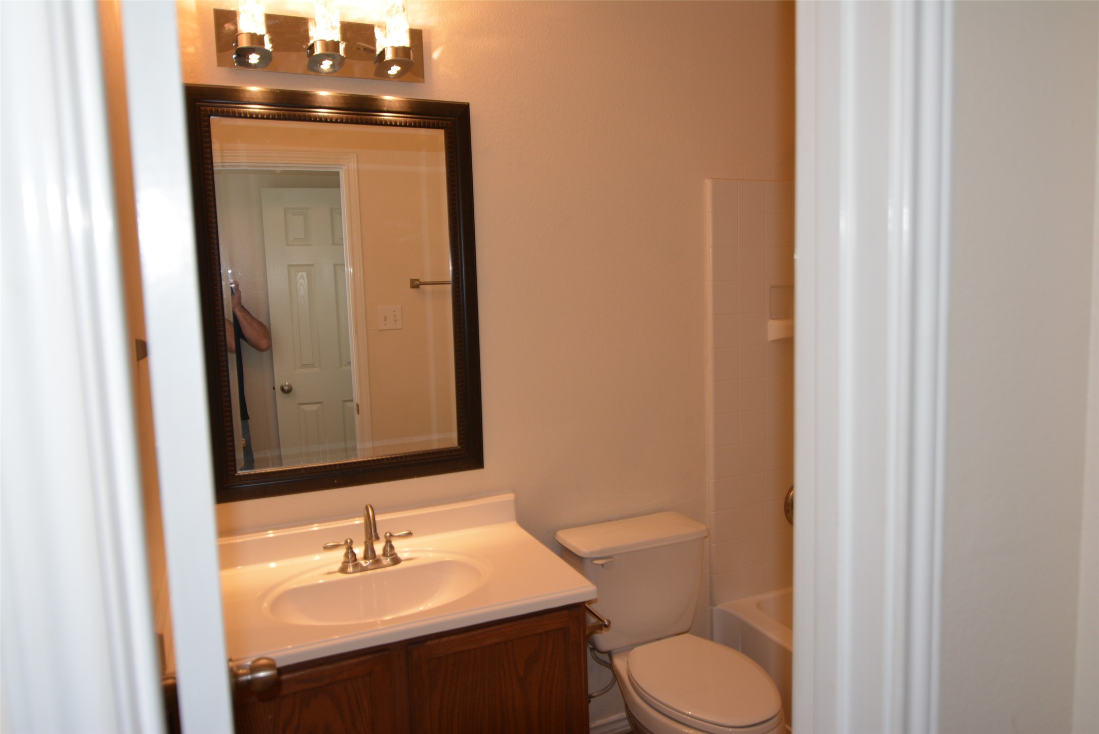 1303 Horseshoe Ranch Drive Leander, TX 78641 - Photo 22 of 26 A well-appointed bath features a sleek vanity, mirror, and essential fixtures.