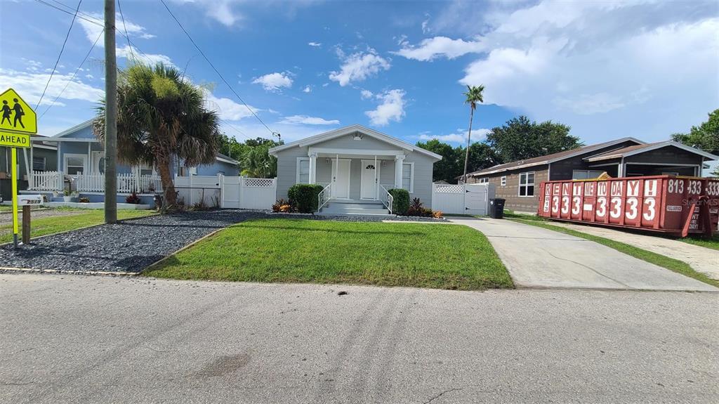 2519 West Walnut Street Tampa, FL 33607 - Photo 1 of 19 a front view of a house with a yard