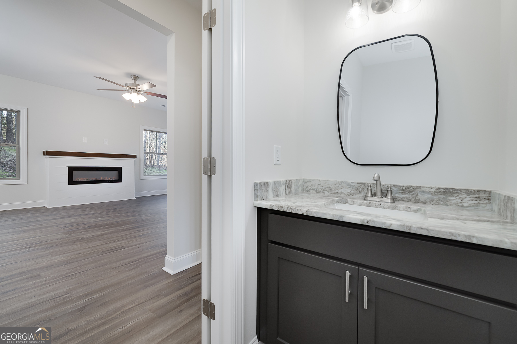 245 Pelican Circle Monticello, GA 31064 - Photo 19 of 37 a bathroom with a sink and a mirror