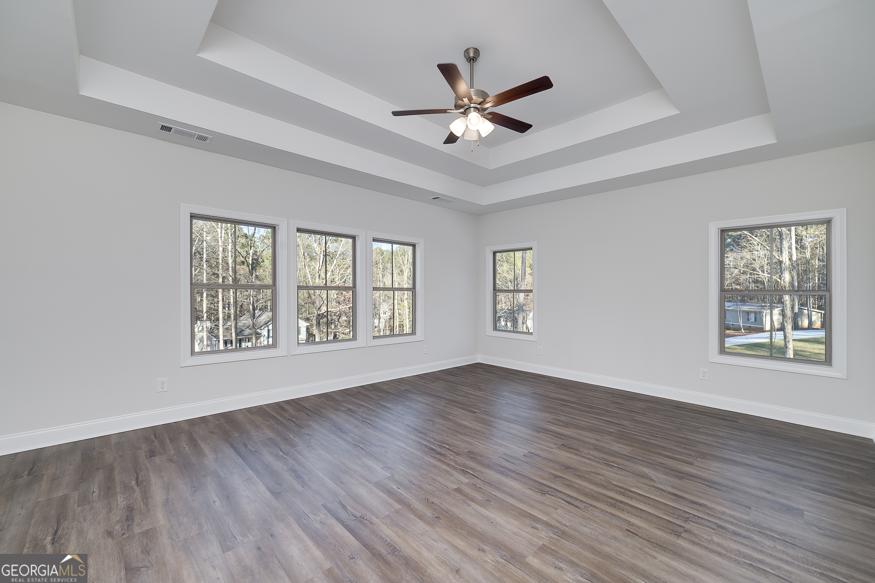 245 Pelican Circle Monticello, GA 31064 - Photo 20 of 37 a view of an empty room with wooden floor and a window