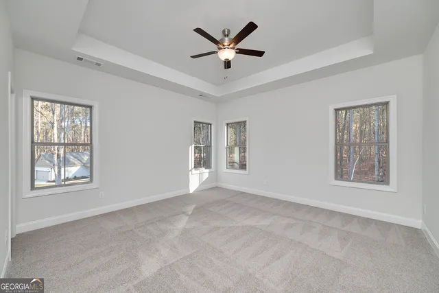 a bathroom with a granite countertop sink toilet a mirror and shower