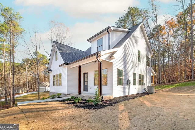 a view of a white house with a large windows