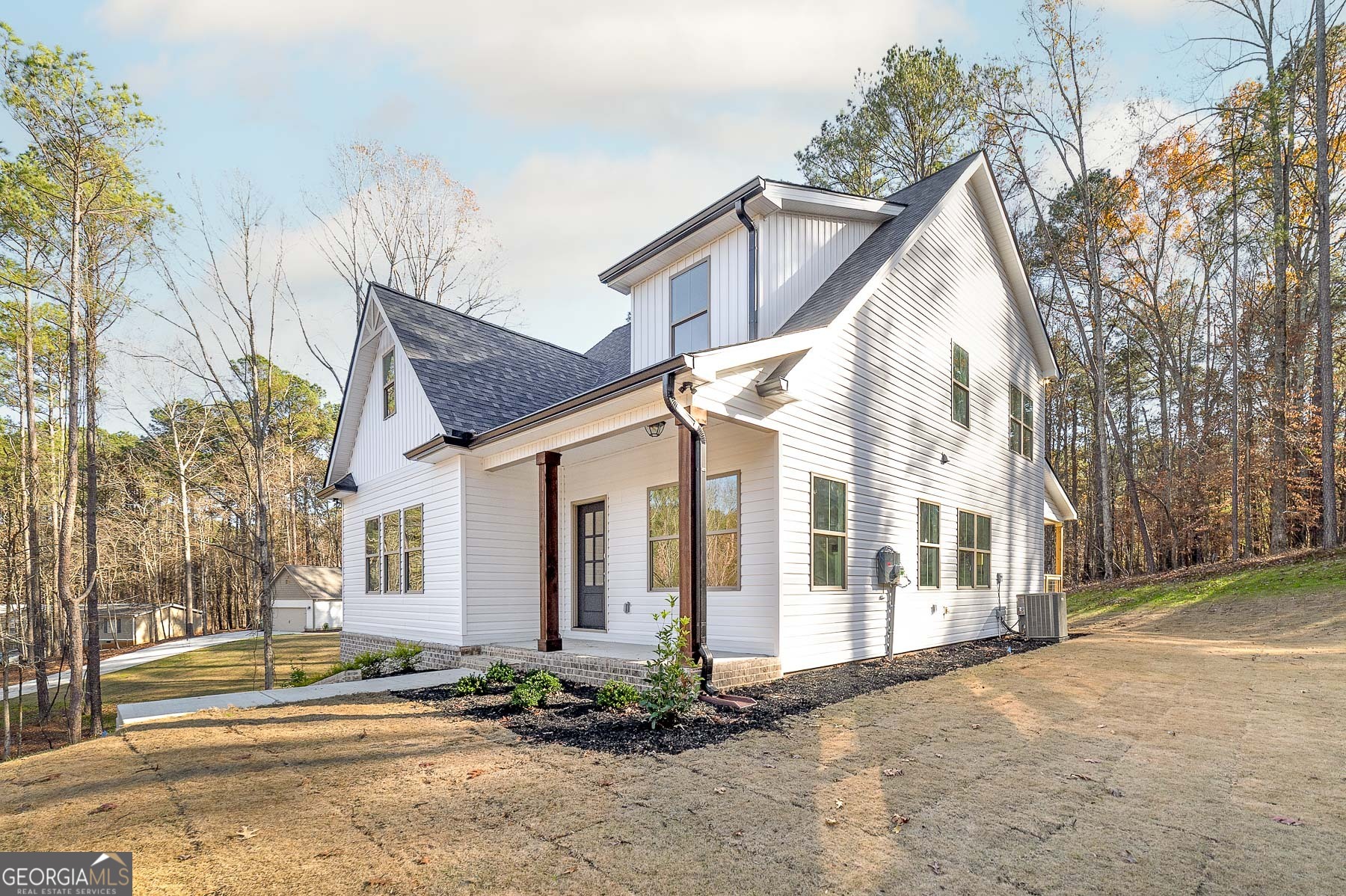 245 Pelican Circle Monticello, GA 31064 - Photo 9 of 37 a view of a white house with a large windows