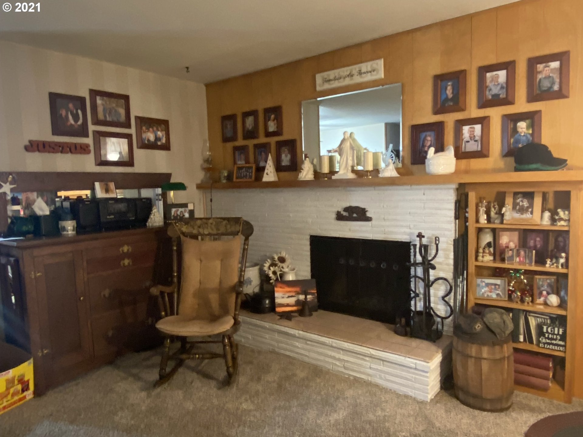 3227 Southwest Isaac Avenue Pendleton, OR 97801 - Photo 3 of 30 a living room with furniture and a fireplace