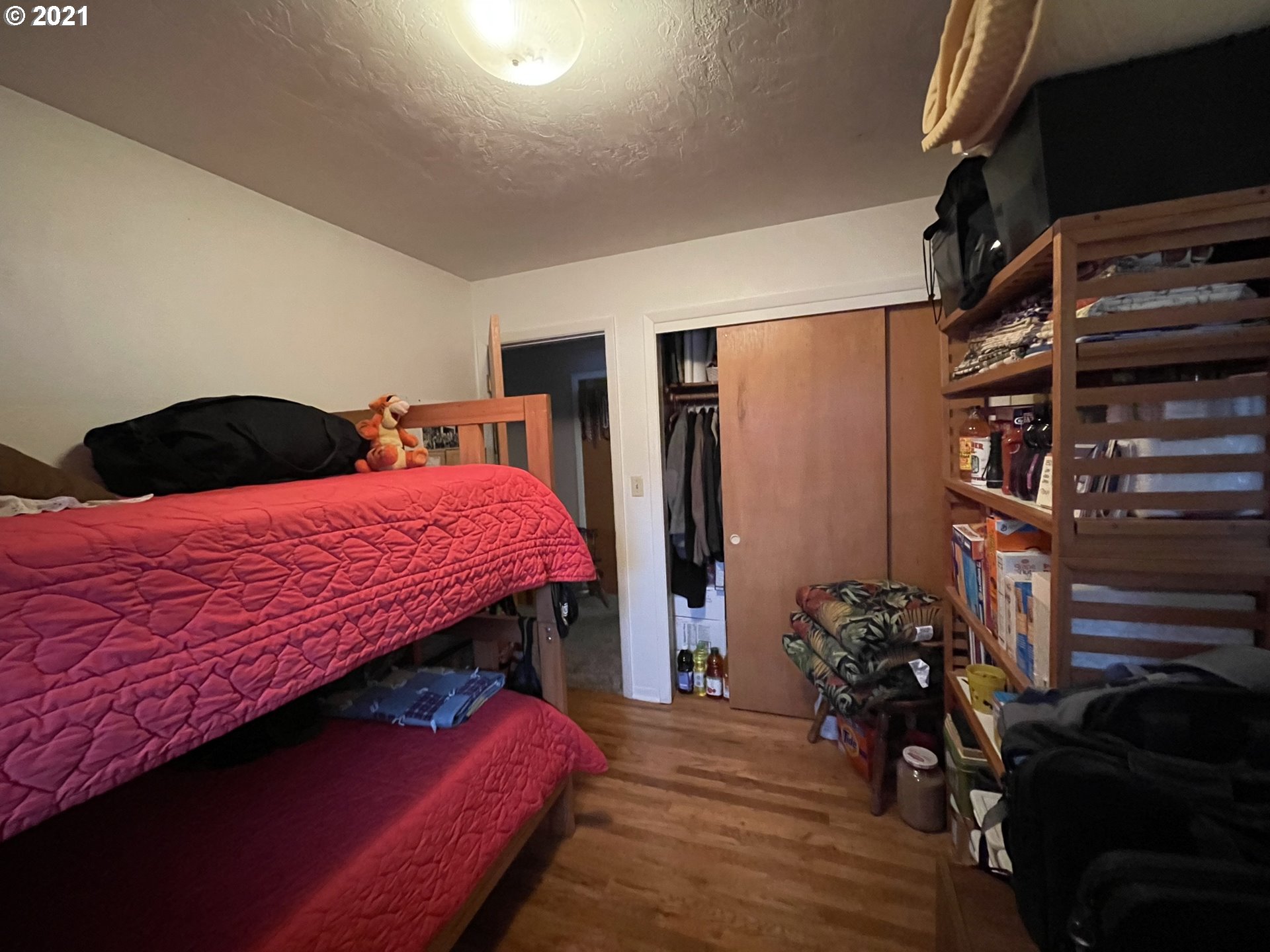 3227 Southwest Isaac Avenue Pendleton, OR 97801 - Photo 22 of 30 a bedroom with a bed and a book shelf