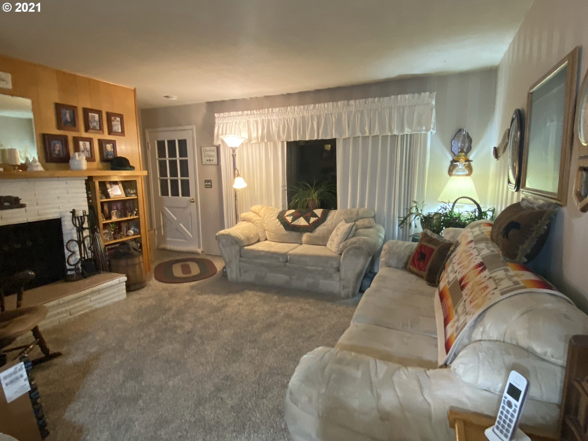 3227 Southwest Isaac Avenue Pendleton, OR 97801 - Photo 4 of 30 a living room with furniture and a flat screen tv