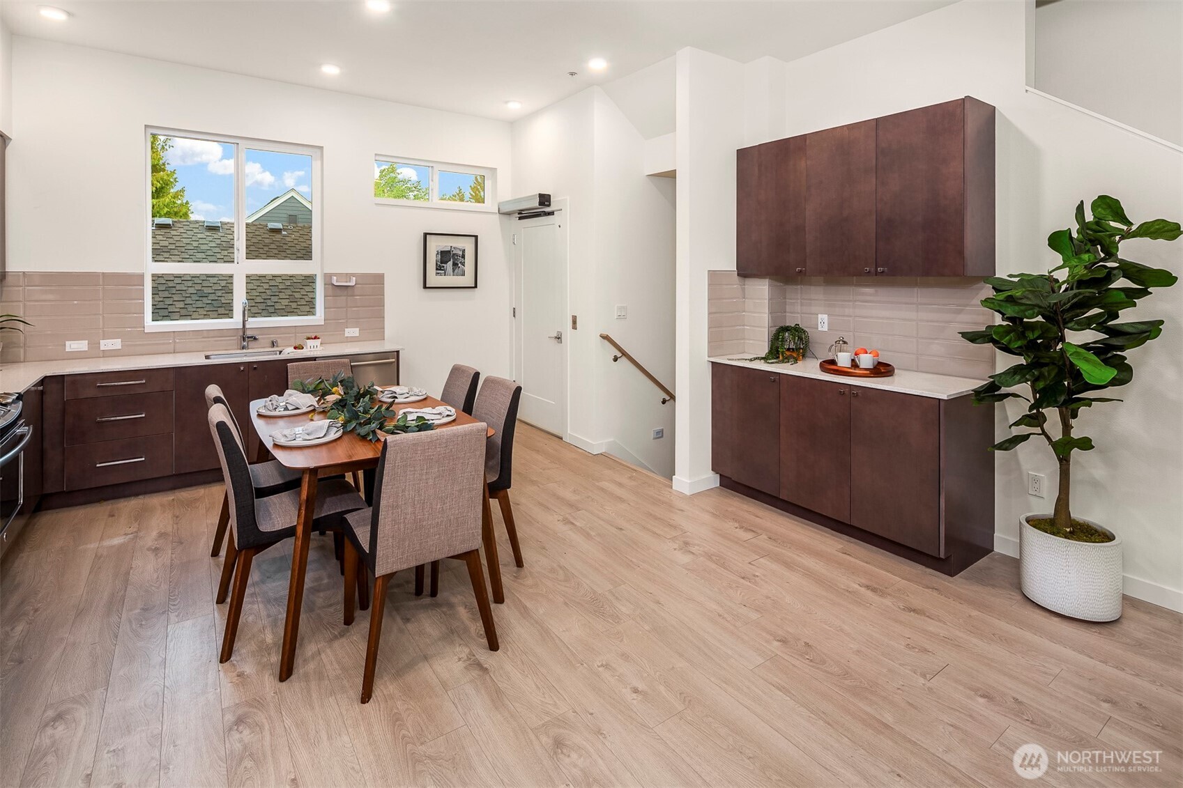 1494 Northwest 75th Street Seattle, WA 98117 - Photo 11 of 22 a view of a dining room with furniture window and wooden floor