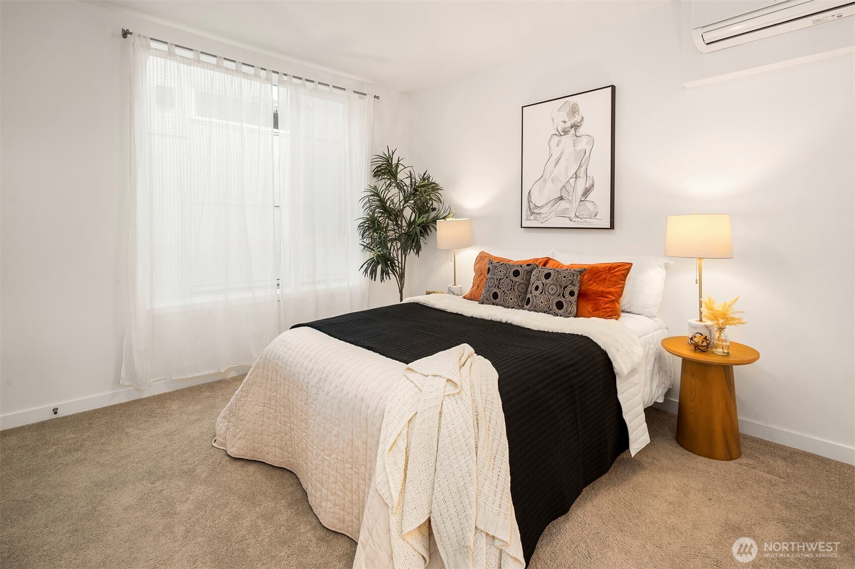 1494 Northwest 75th Street Seattle, WA 98117 - Photo 15 of 22 a bedroom with a bed and a lamp on table