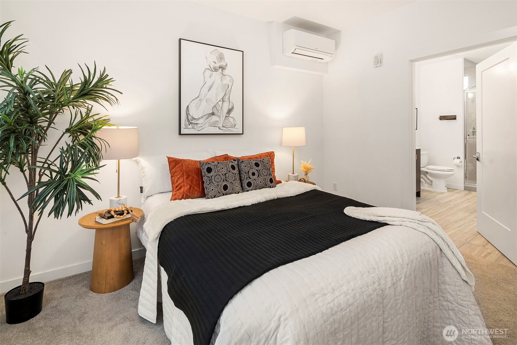 1494 Northwest 75th Street Seattle, WA 98117 - Photo 16 of 22 a bedroom with a bed and a potted plant