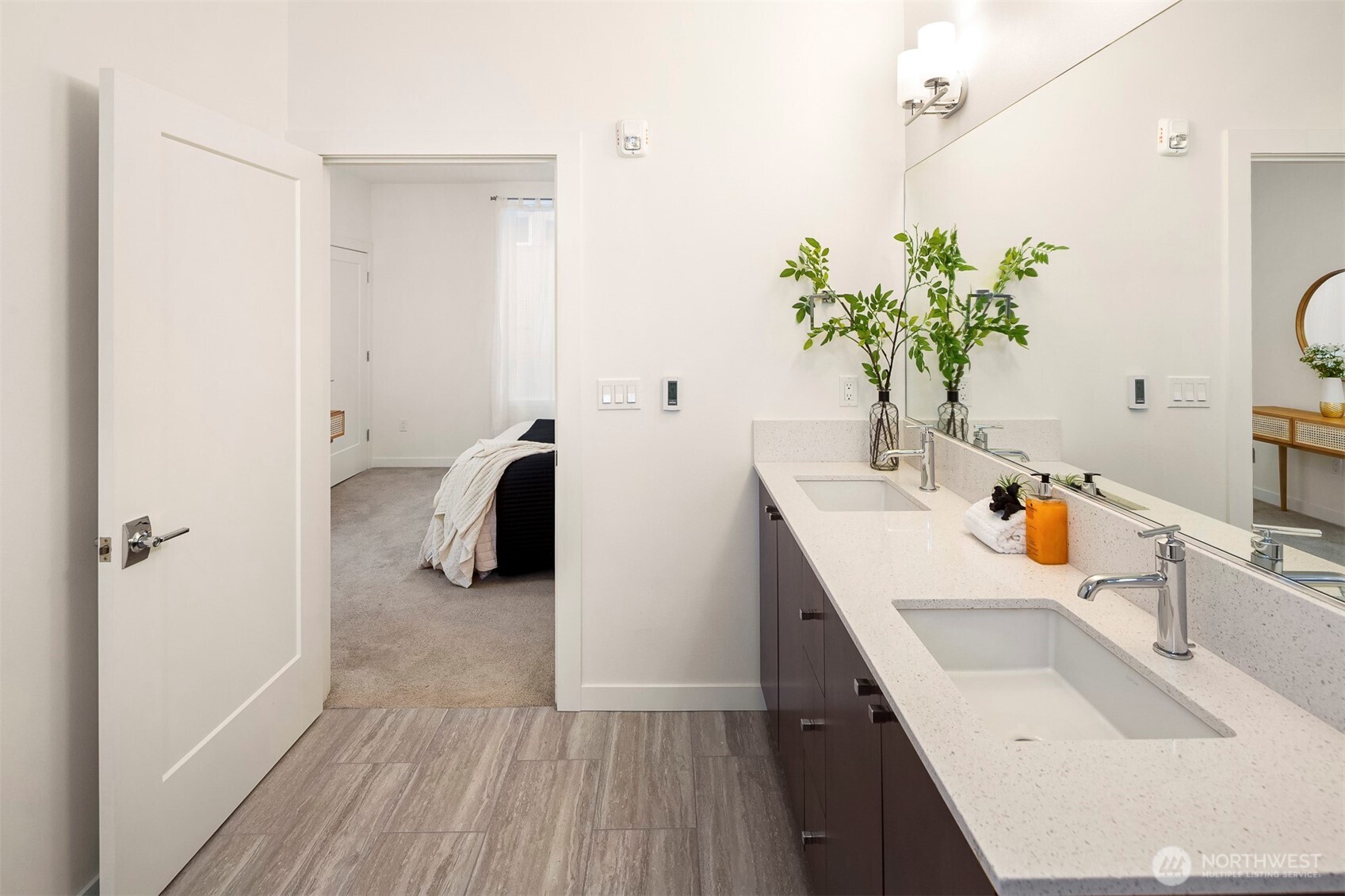 1494 Northwest 75th Street Seattle, WA 98117 - Photo 18 of 22 a bathroom with a sink a mirror and a shower