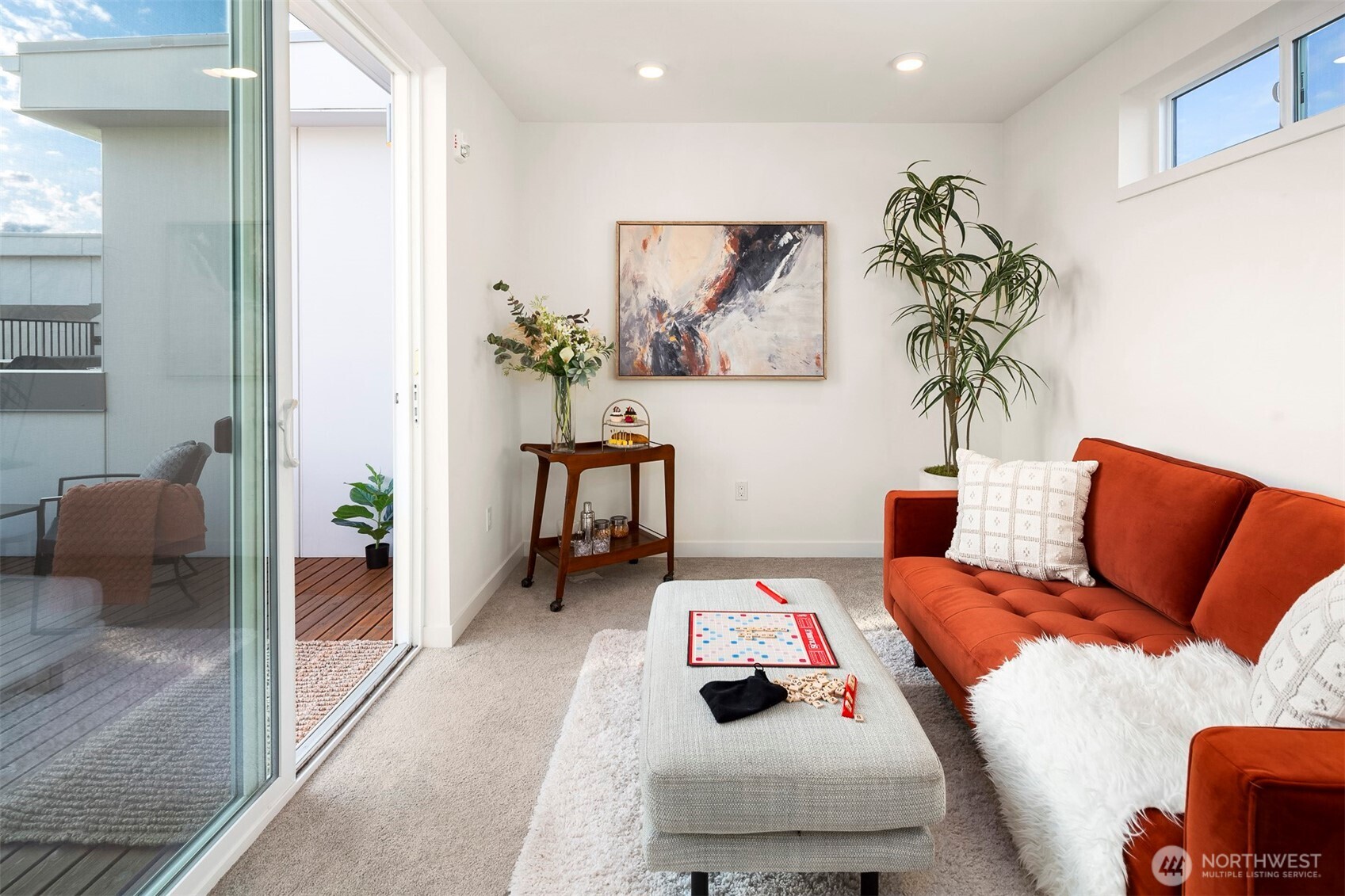 1494 Northwest 75th Street Seattle, WA 98117 - Photo 21 of 22 a living room with furniture and a potted plant