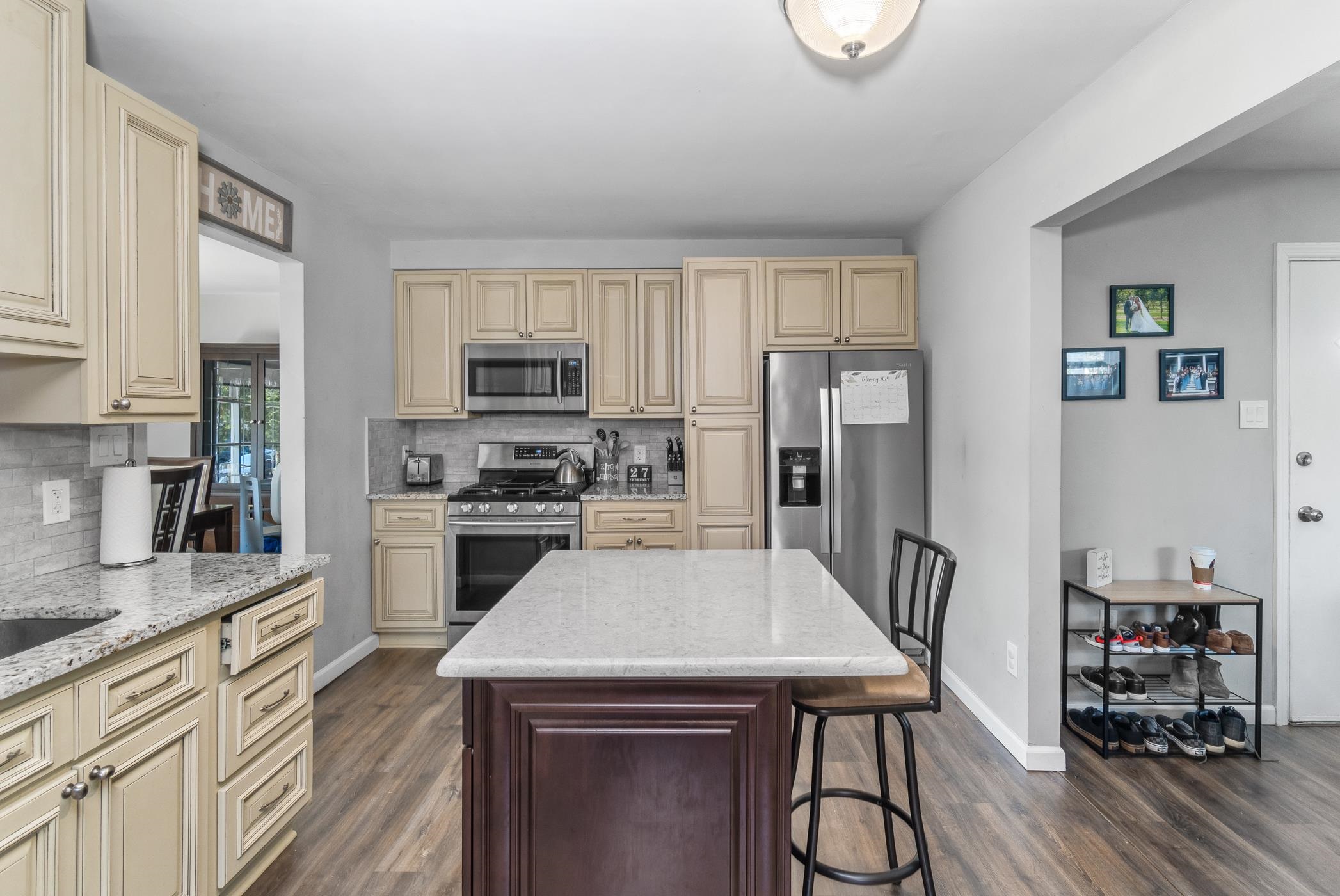 6 Haddon Road Somers Point, NJ 08244 - Photo 16 of 33 a kitchen with a table chairs refrigerator and microwave