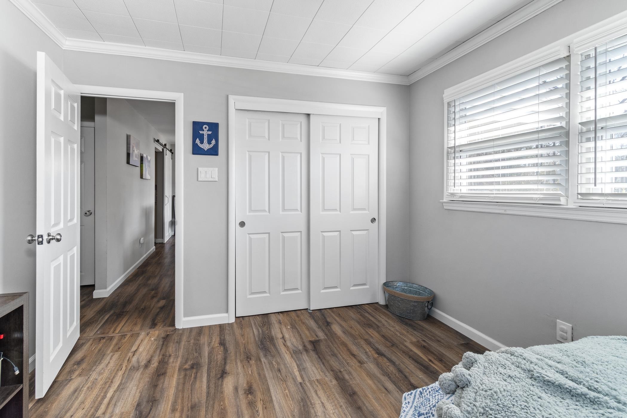 6 Haddon Road Somers Point, NJ 08244 - Photo 6 of 33 a bedroom with a bed and wooden floor