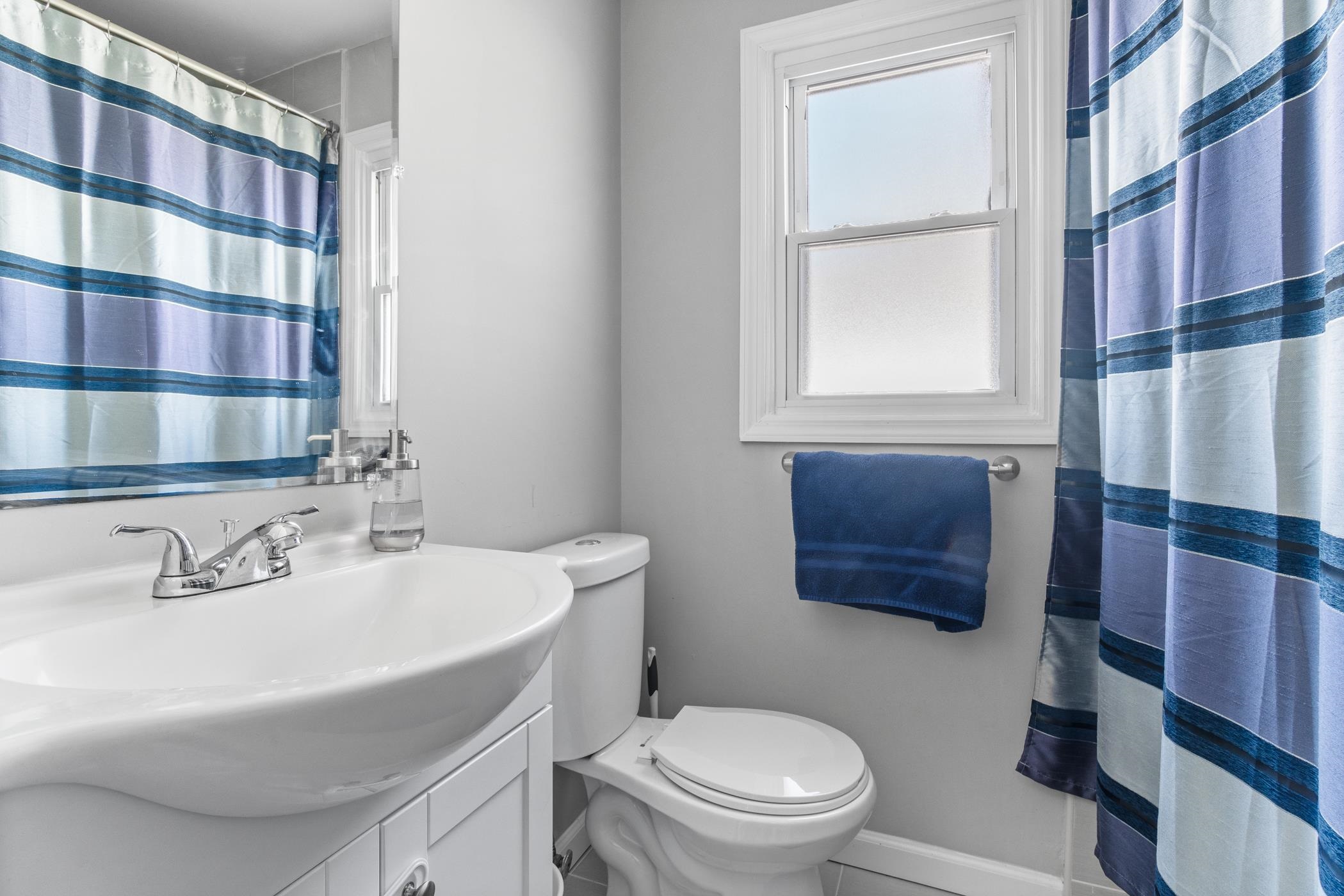 6 Haddon Road Somers Point, NJ 08244 - Photo 7 of 33 a bathroom with a sink a toilet and shower