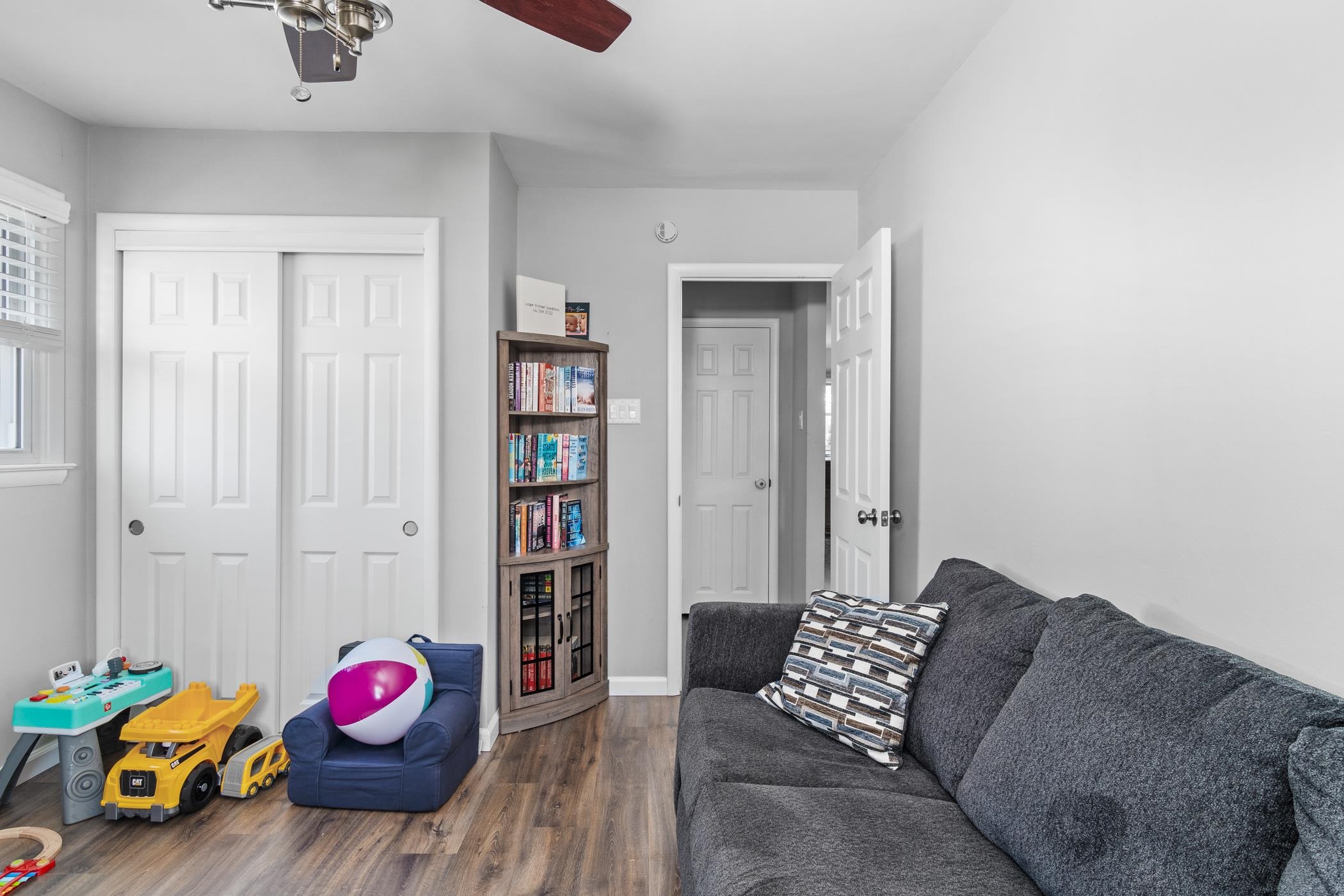 6 Haddon Road Somers Point, NJ 08244 - Photo 8 of 33 a living room with furniture and book shelf